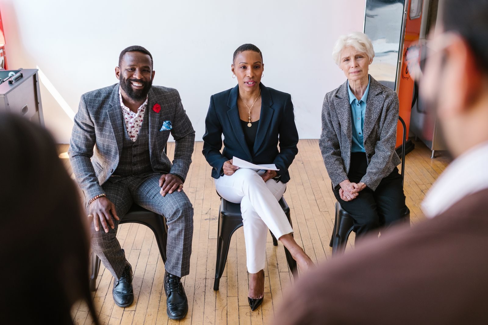 A group of professionals listening attentively during a leadership discussion