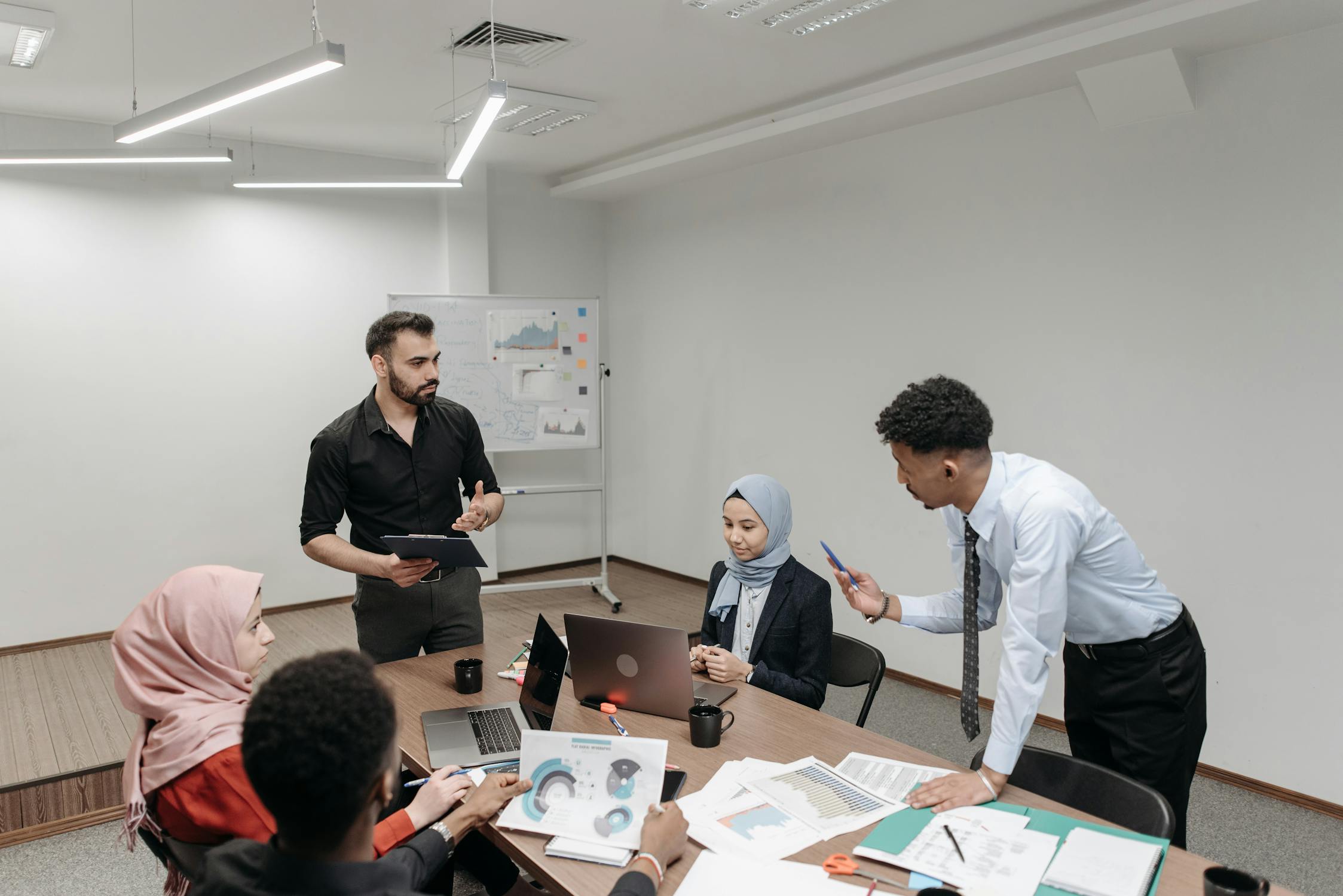 C-suite executives in a boardroom strategy discussion