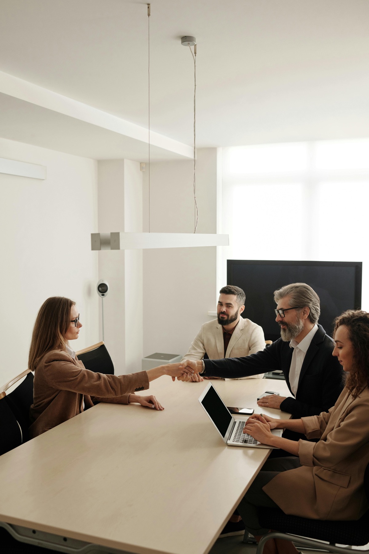Senior leader communicating with authority and credibility in an executive meeting