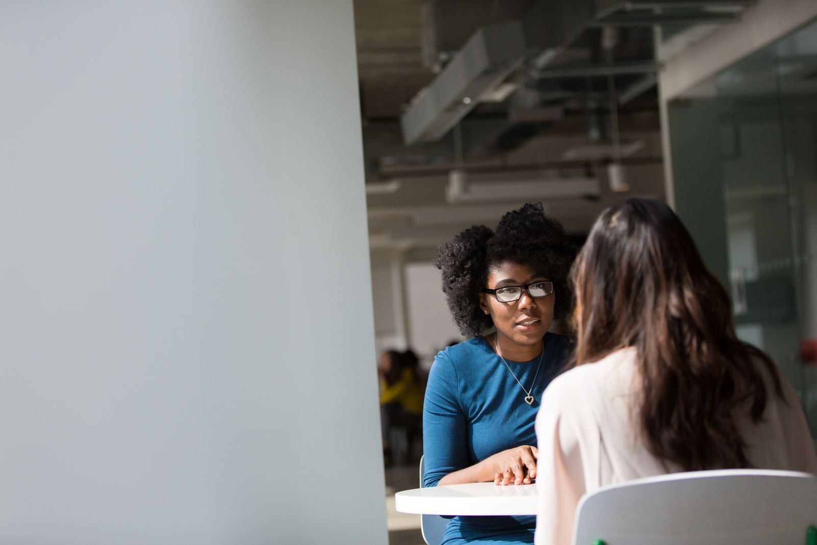 One-on-one executive coaching conversation between two leaders